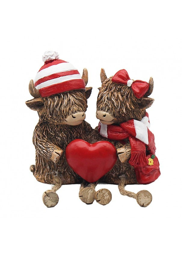 The Highland Cows With Red Hat And Scarf Holding Heart