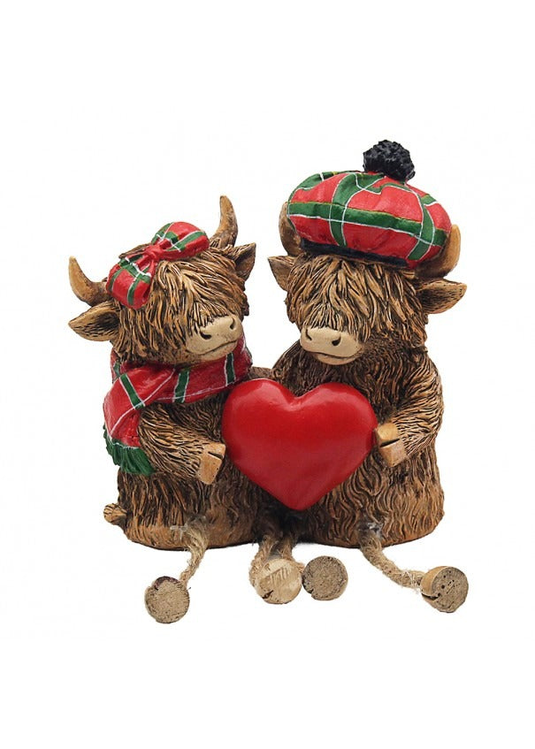 The Highland Cows With Tartan Hat And Scarf Holding Heart